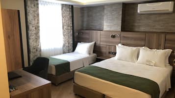 Triple Room | Minibar, in-room safe, desk, soundproofing