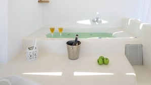 A white room with a bathtub, a shelf with bottles, and a bucket with apples. - Blue Sky Summer (Naxos)