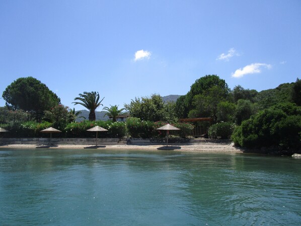 On the beach, sun-loungers