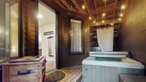 A wooden deck with a hot tub, a wooden table, and a bench. - Modernist Mountain View Retreat in Old Mill!! Hot Tub!!!  Pool Table!!! (Bend)