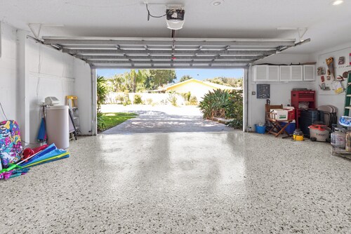 This beauty is centrally located,  with a heated pool and water fall!