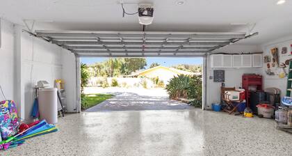This beauty is centrally located, with a heated pool and water fall!