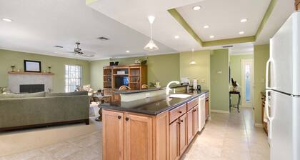 This beauty is centrally located, with a heated pool and water fall!