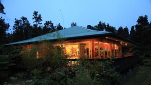 A house with a metal roof, surrounded by dense vegetation. - ~Peace and Tranquility in rain-forested Volcano on luxurious property ~ (Volcano)