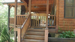 A wooden cabin with a porch and a sign that reads "Eagles Rest." - 3 King Suites! Great Views! Outdoor Fireplace! Paved Roads! Pets! Access Ramp! (Blue Ridge)