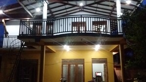 A two-story building with a balcony on the upper floor. - Padmi Villa (Weligama)