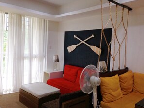 Suite familiale | Aire de séjour | Téléviseur à écran plat