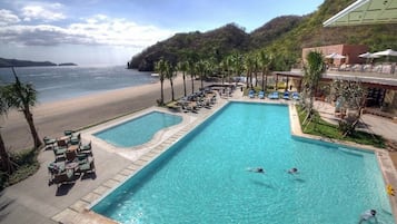 4 outdoor pools, open 6 AM to 10 PM, pool umbrellas, pool loungers
