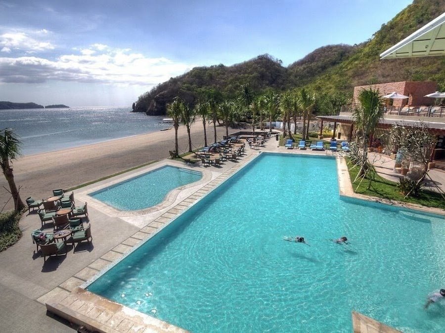 4 outdoor pools, open 6 AM to 10 PM, pool umbrellas, pool loungers