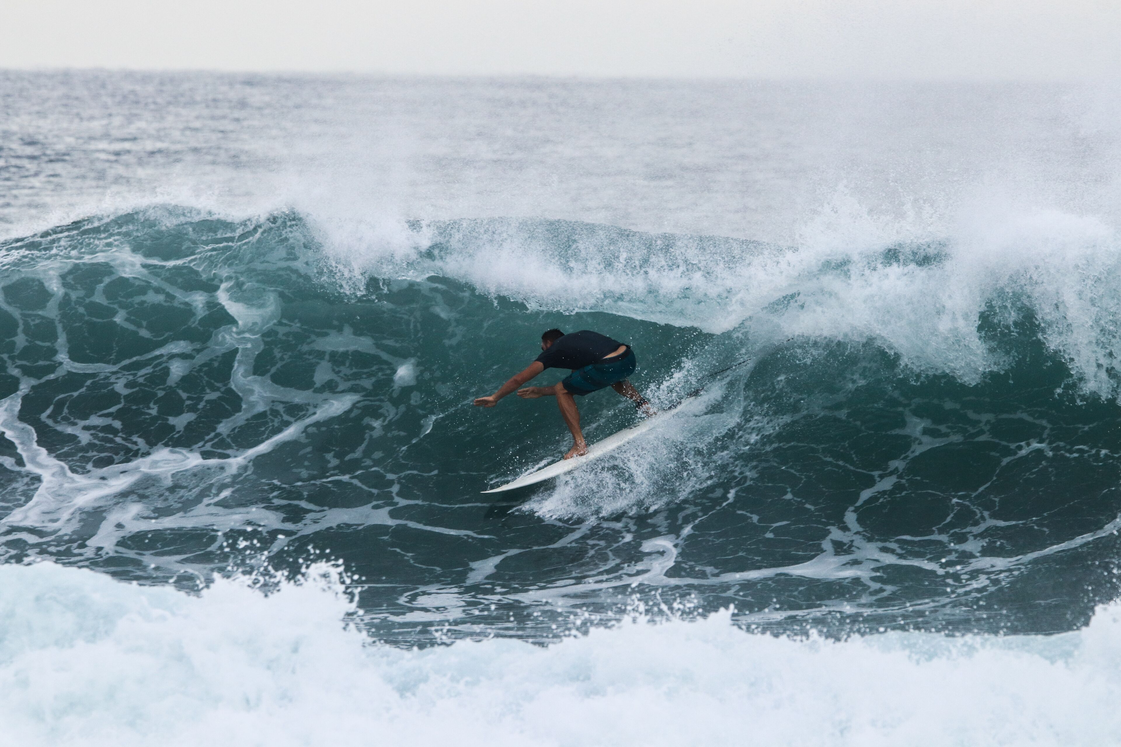 A surfer riding a wave.