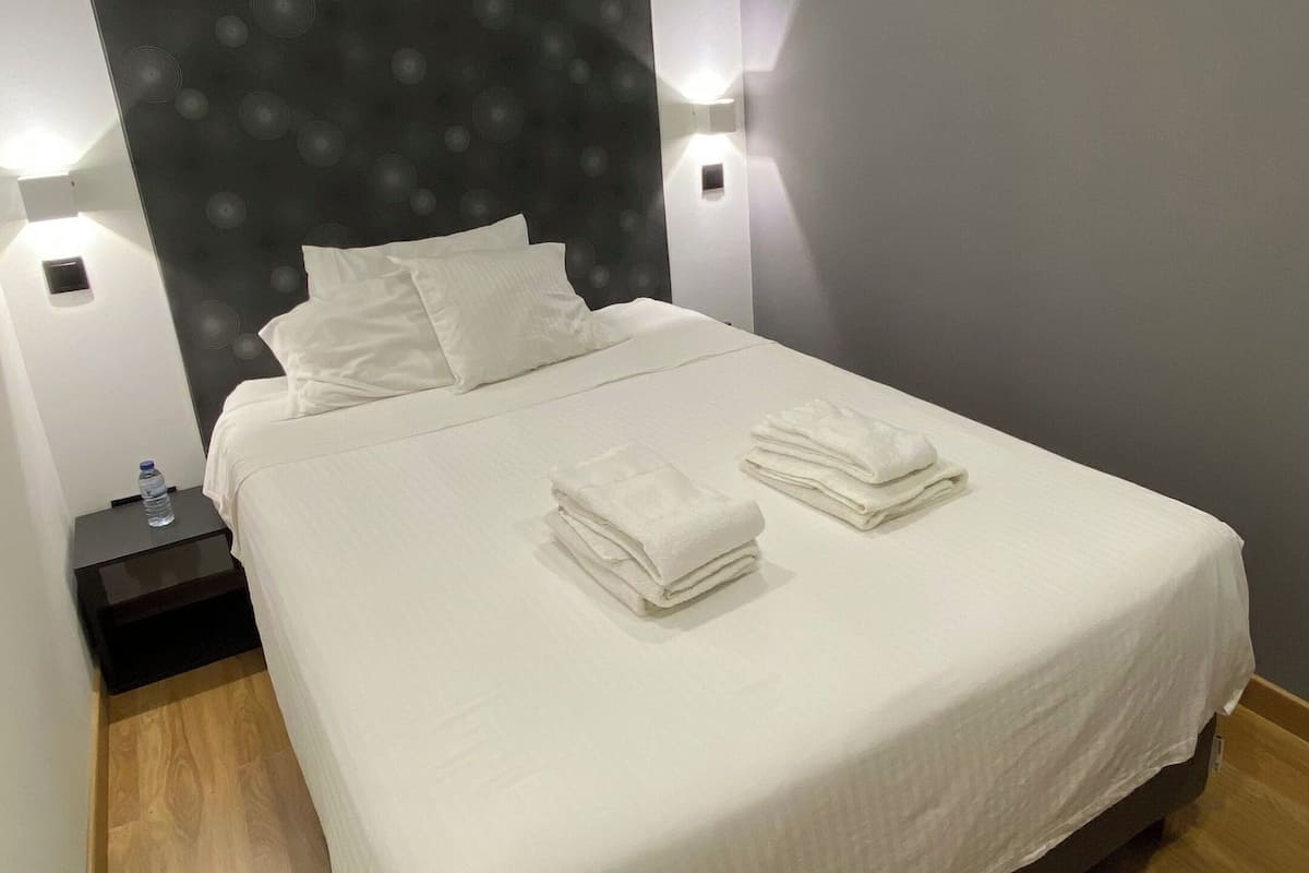 Economy Apartment, 1 Queen Bed, Private Bathroom, City View | 1 bedroom, premium bedding, minibar, in-room safe