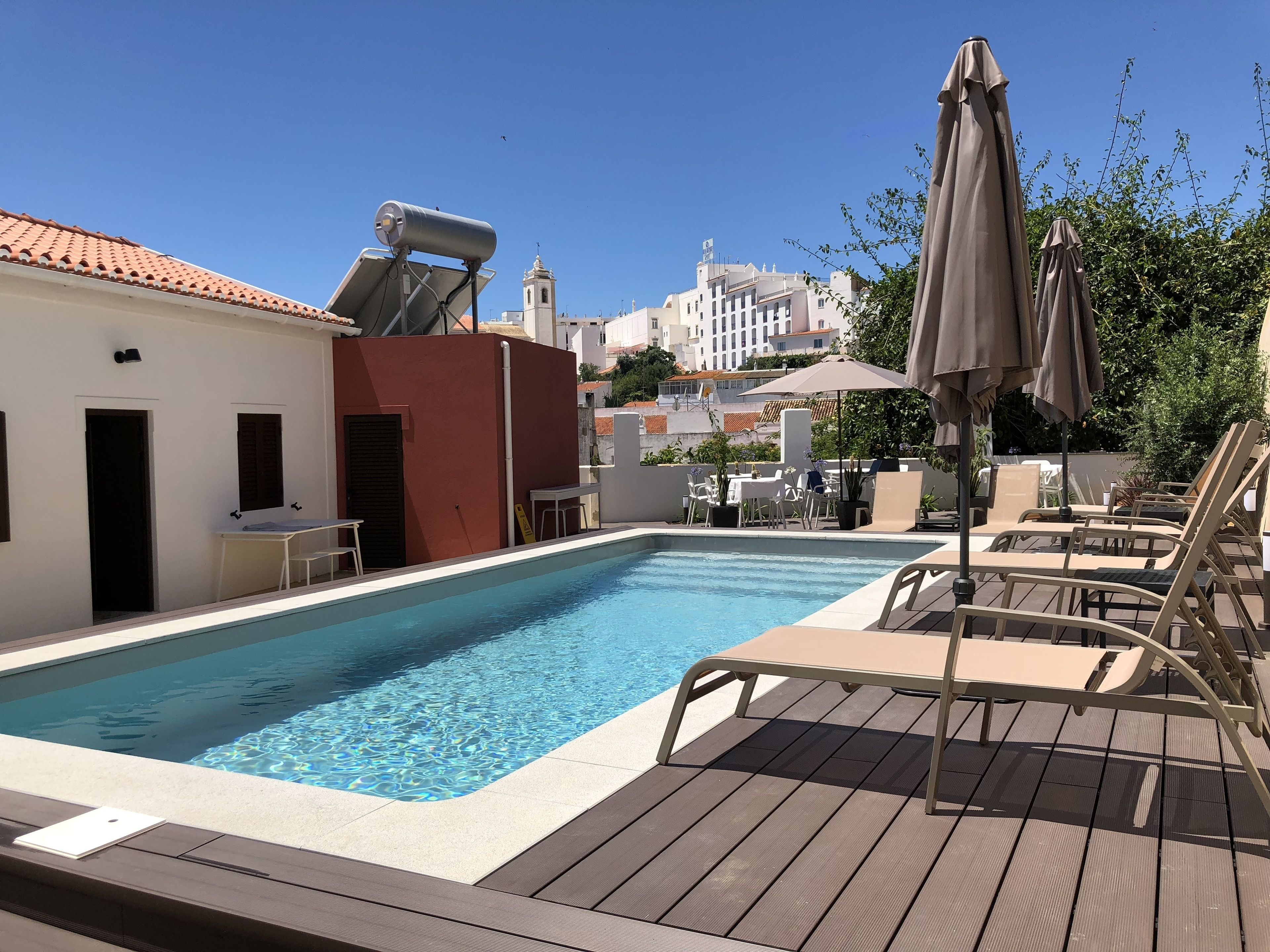 Outdoor pool, pool umbrellas, pool loungers