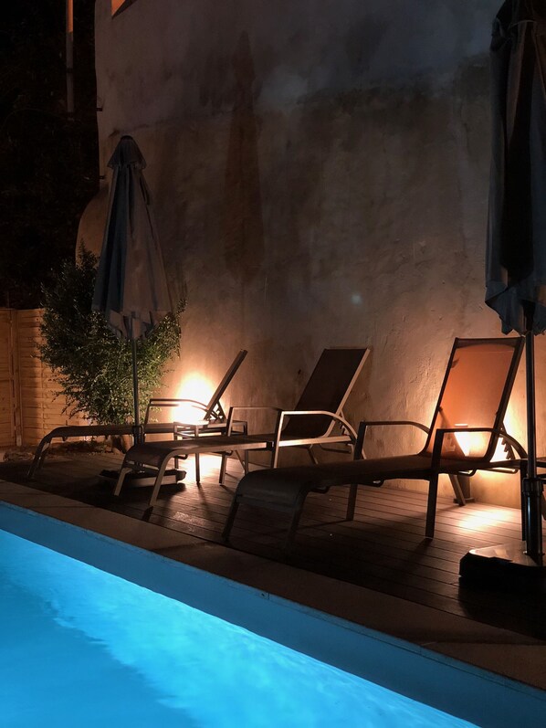 Outdoor pool, open 8 AM to 9 PM, pool umbrellas, pool loungers