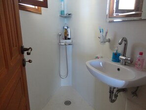 Shower, hair dryer, bathrobes, slippers