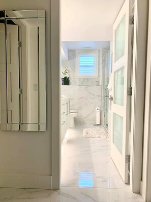 Shower, hair dryer, towels, soap