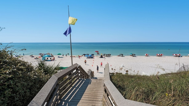 A wooden staircase leading to a beach with umbrellas and beach chairs. - Pool, 3 Mins to the Beach, Hidden Oasis in BMB + Free Attraction Tickets! (Santa Rosa Beach)