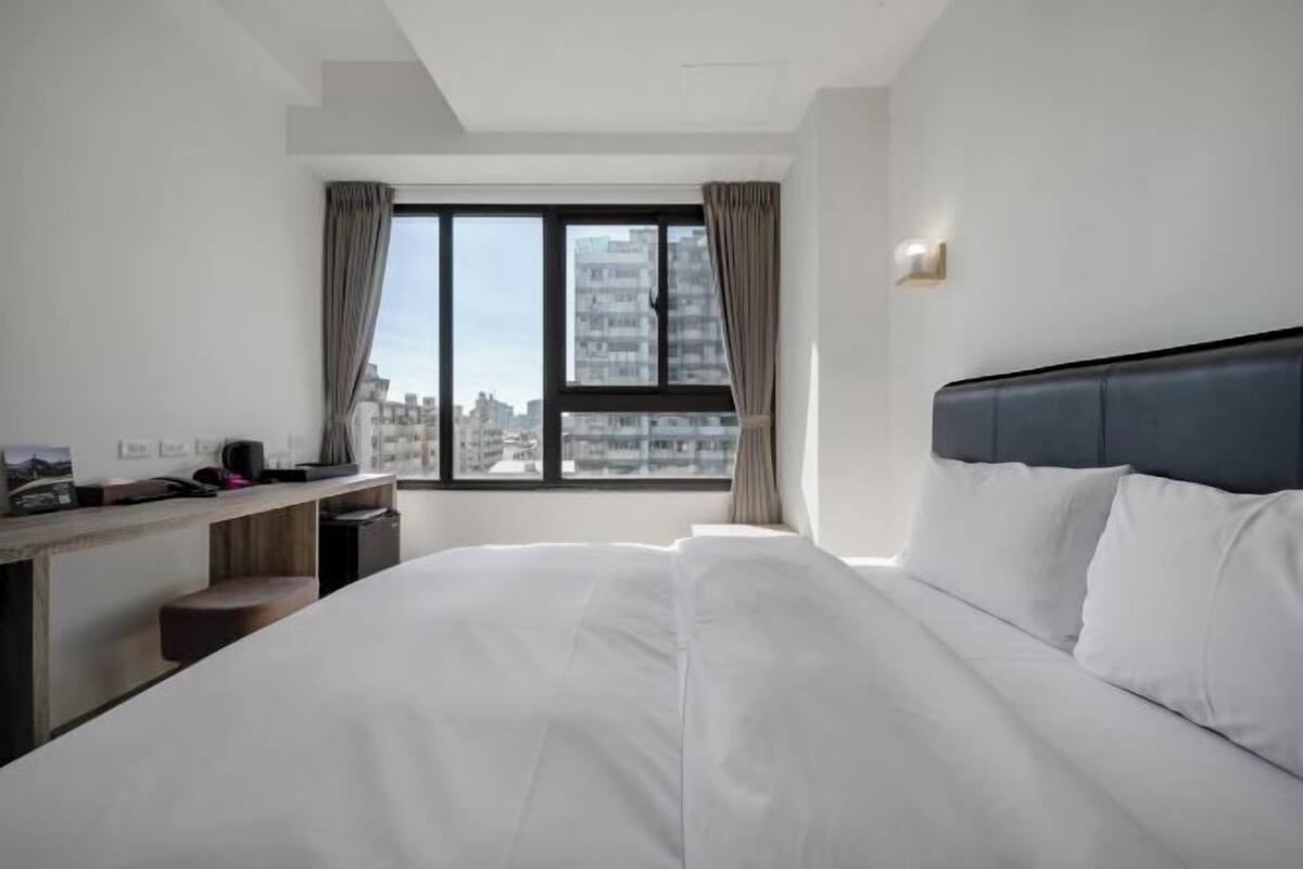 Premium bedding, pillow-top beds, desk, laptop workspace