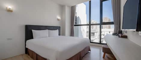 Premium bedding, pillow-top beds, desk, laptop workspace