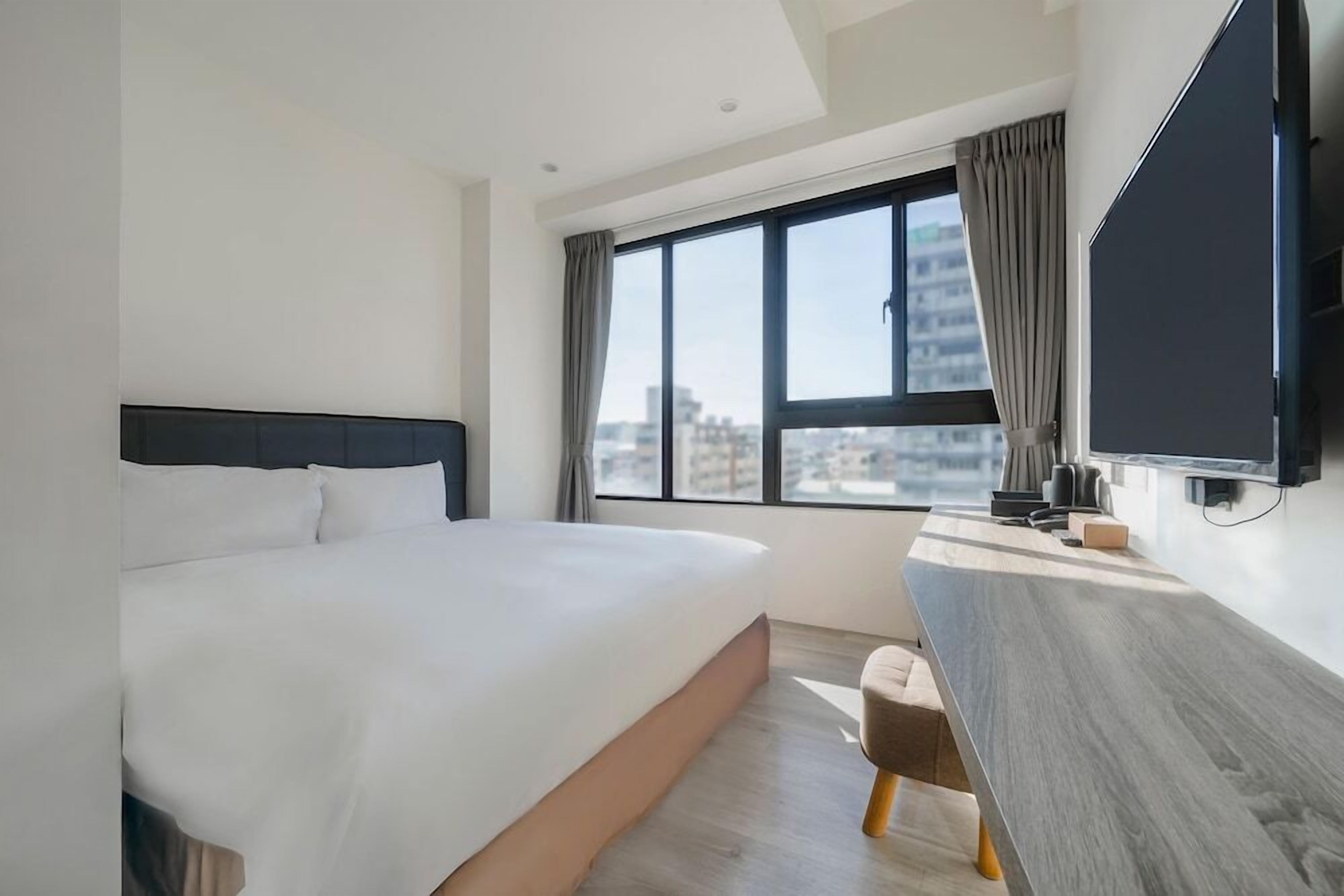 Premium bedding, pillow-top beds, desk, laptop workspace