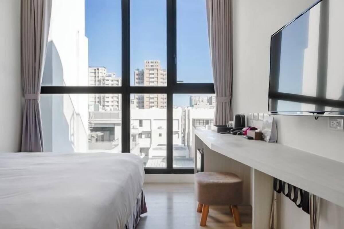 Premium bedding, pillow-top beds, desk, laptop workspace