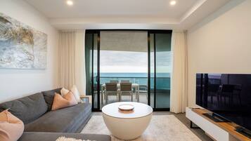 Three Bedroom Oceanfront View Apartment (High Floor) | Living area | Flat-screen TV, DVD player
