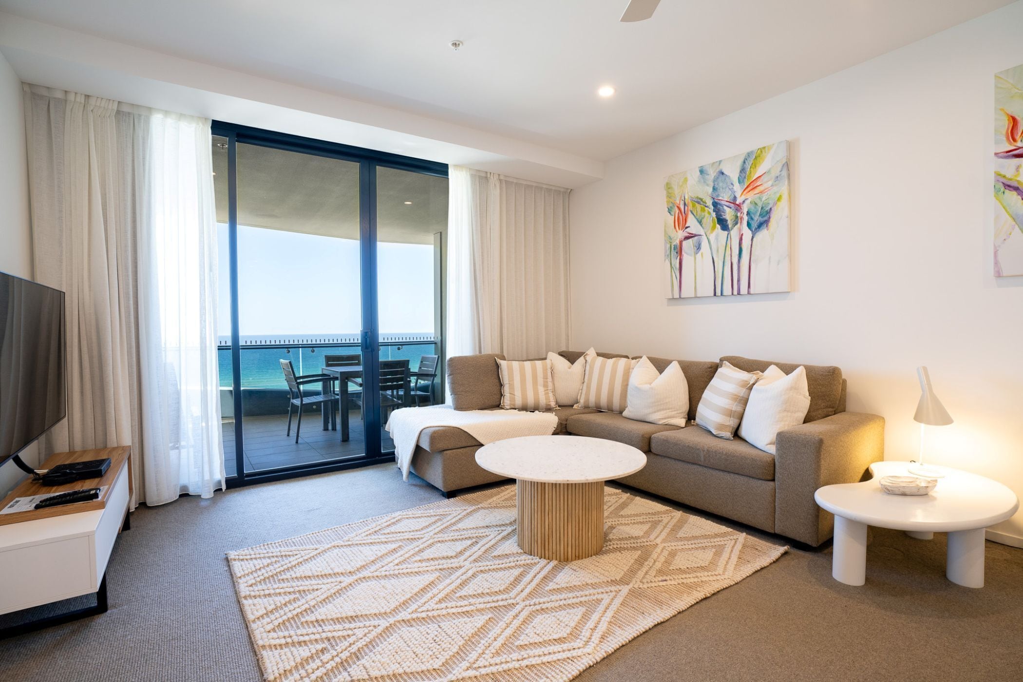 Two Bedroom Oceanfront (High floor) | Living area | Flat-screen TV, DVD player