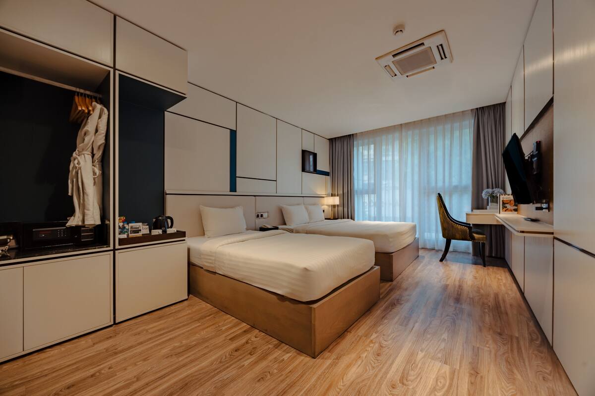 Triple Room, City View | Minibar, in-room safe, desk, free WiFi