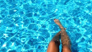 Seasonal outdoor pool, pool loungers