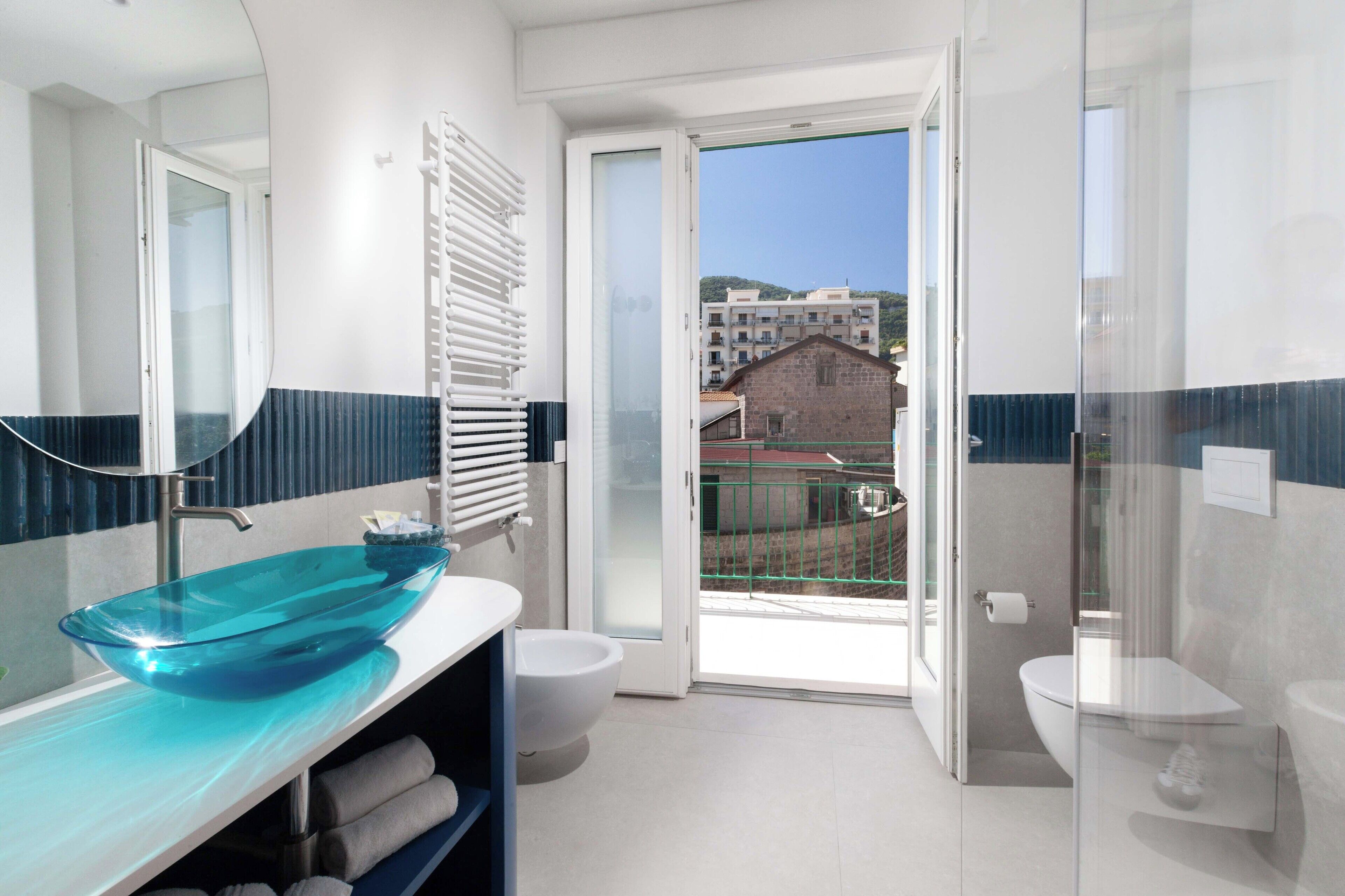 Apartment, 1 Bedroom, Smoking, Balcony | Bathroom | Shower, rainfall showerhead, bidet, towels