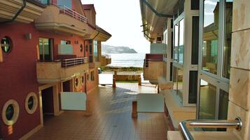 Economy Apartment, 1 Bedroom | Living area | Flat-screen TV