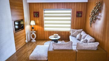Suite presidencial | Ropa de cama de alta calidad y minibar