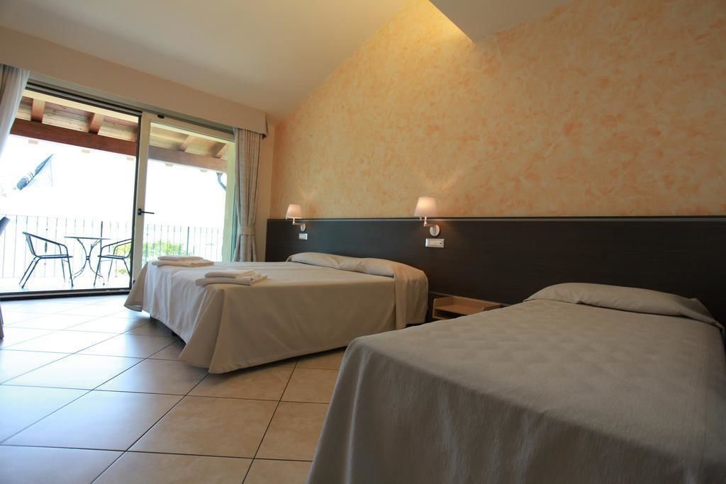 superior triple room, lake view | minibar, in-room safe, desk, soundproofing