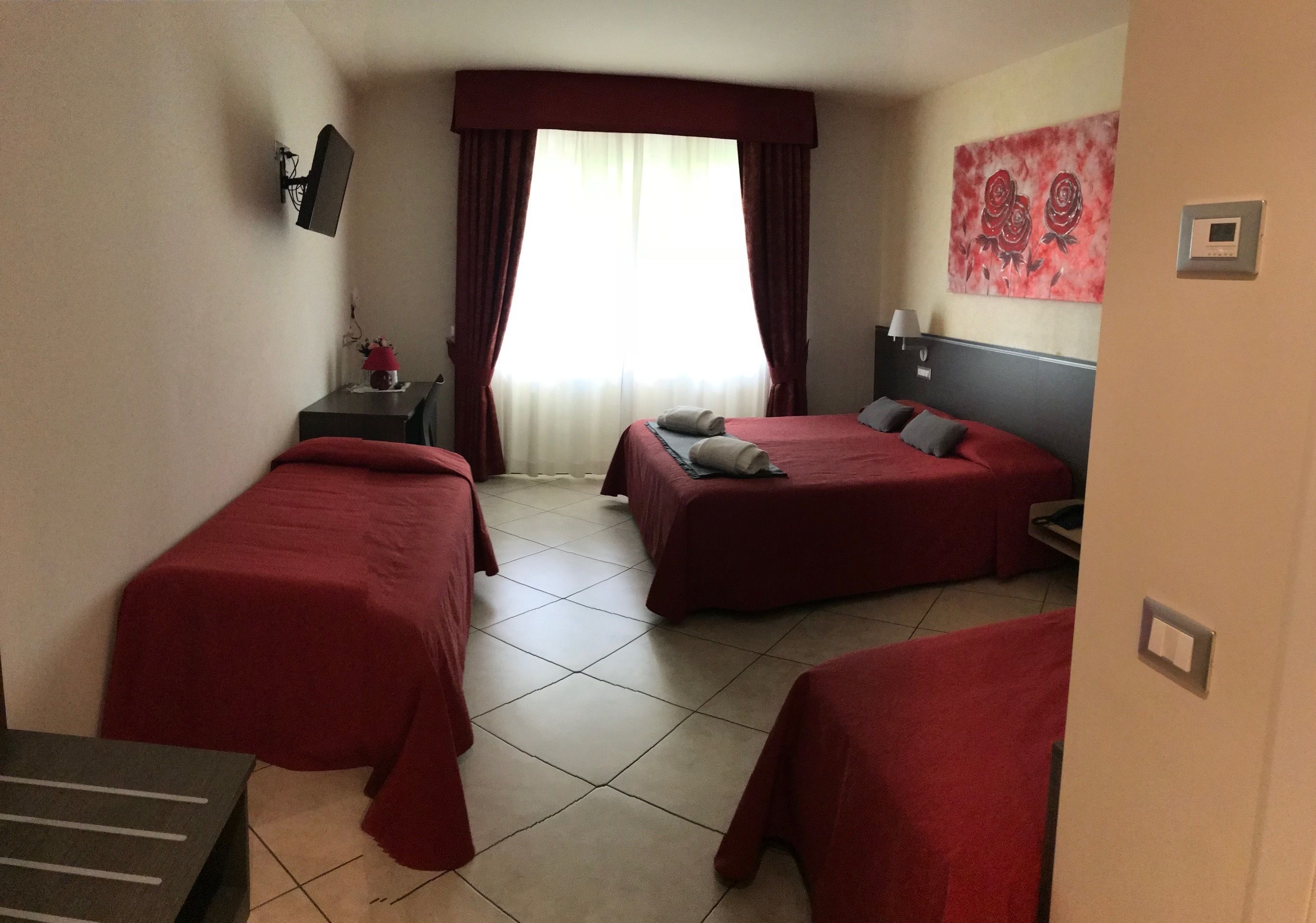 superior triple room, lake view | minibar, in-room safe, desk, soundproofing