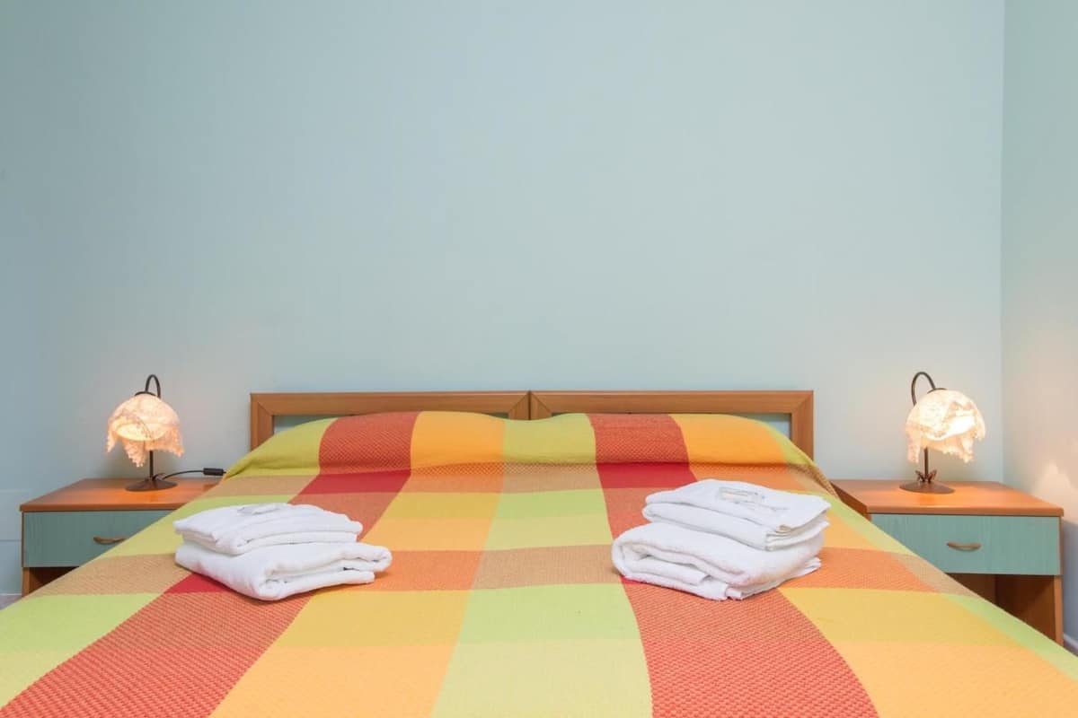 Desk, blackout curtains, iron/ironing board, bed sheets