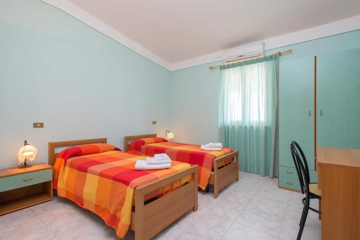 Desk, blackout curtains, iron/ironing board, bed sheets