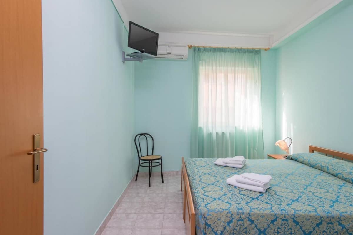 Desk, blackout curtains, iron/ironing board, bed sheets