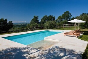 Seasonal outdoor pool, pool umbrellas, pool loungers