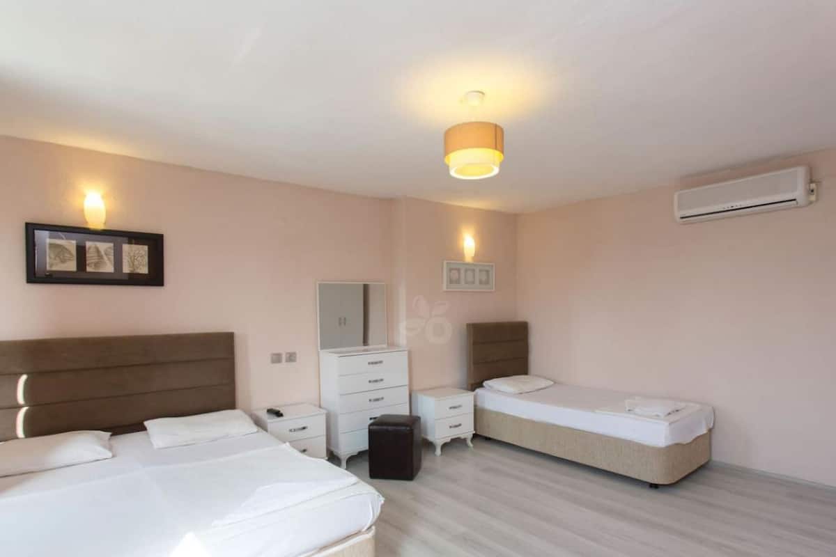 Triple Room | Desk, blackout drapes, iron/ironing board, free cribs/infant beds