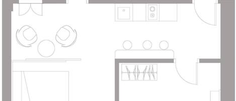 Distribución de un apartamento de 50 m² con cocina, comedor, dos dormitorios y un baño.