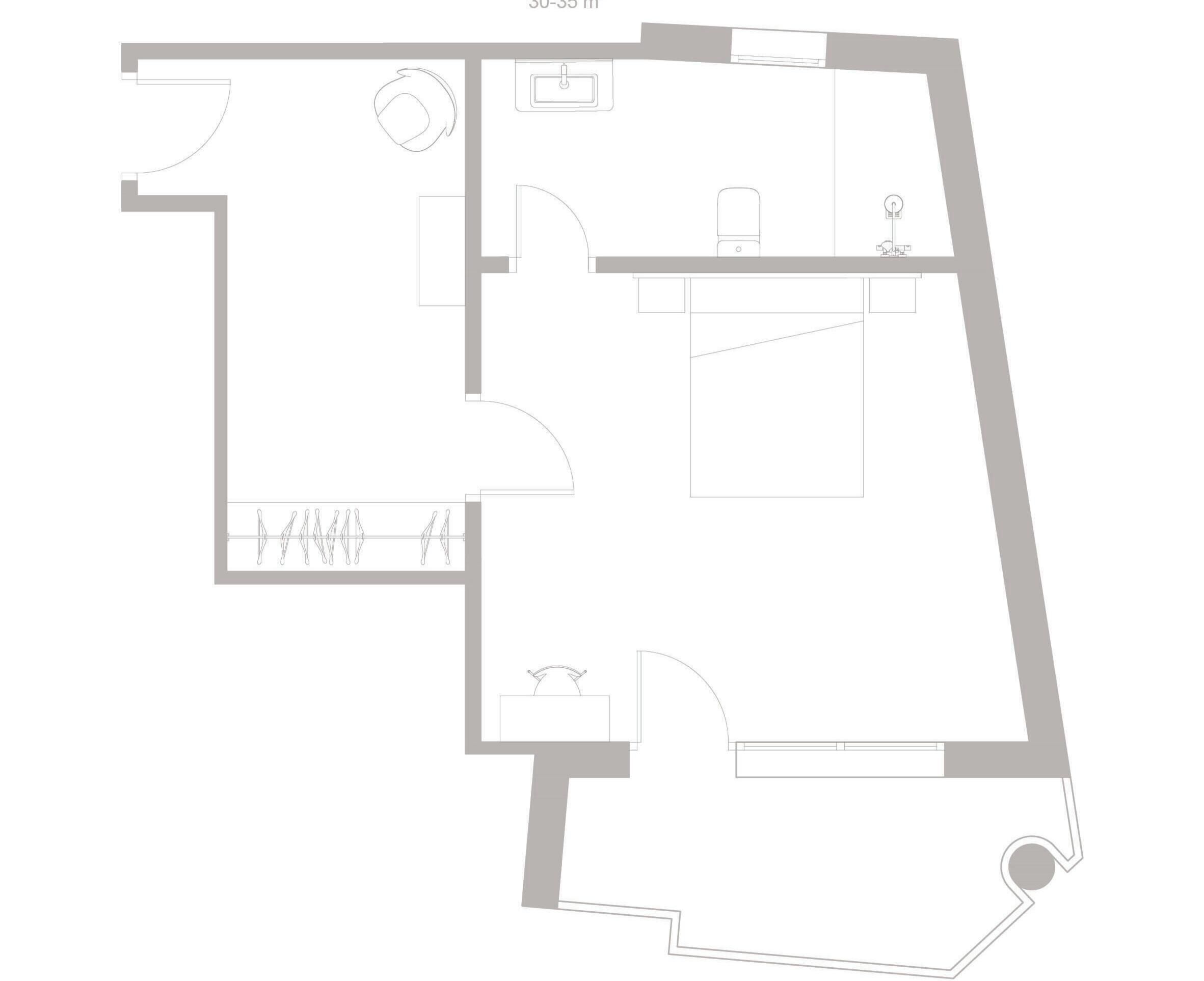 Ein Grundriss mit Küche, Bad und einer Sitzecke.