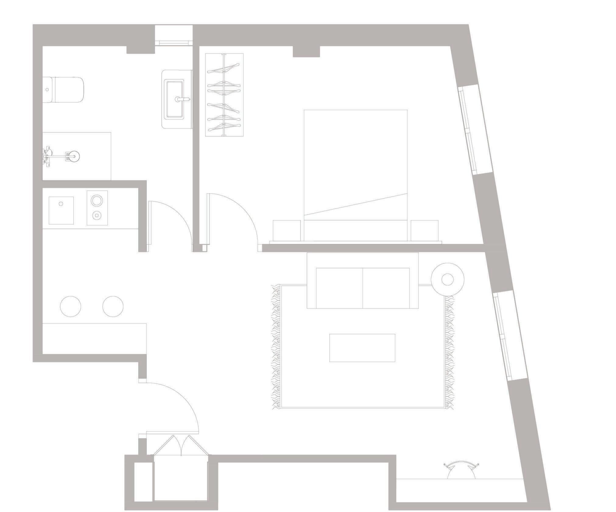 Plano de planta que muestra una cocina, comedor y un amplio dormitorio.