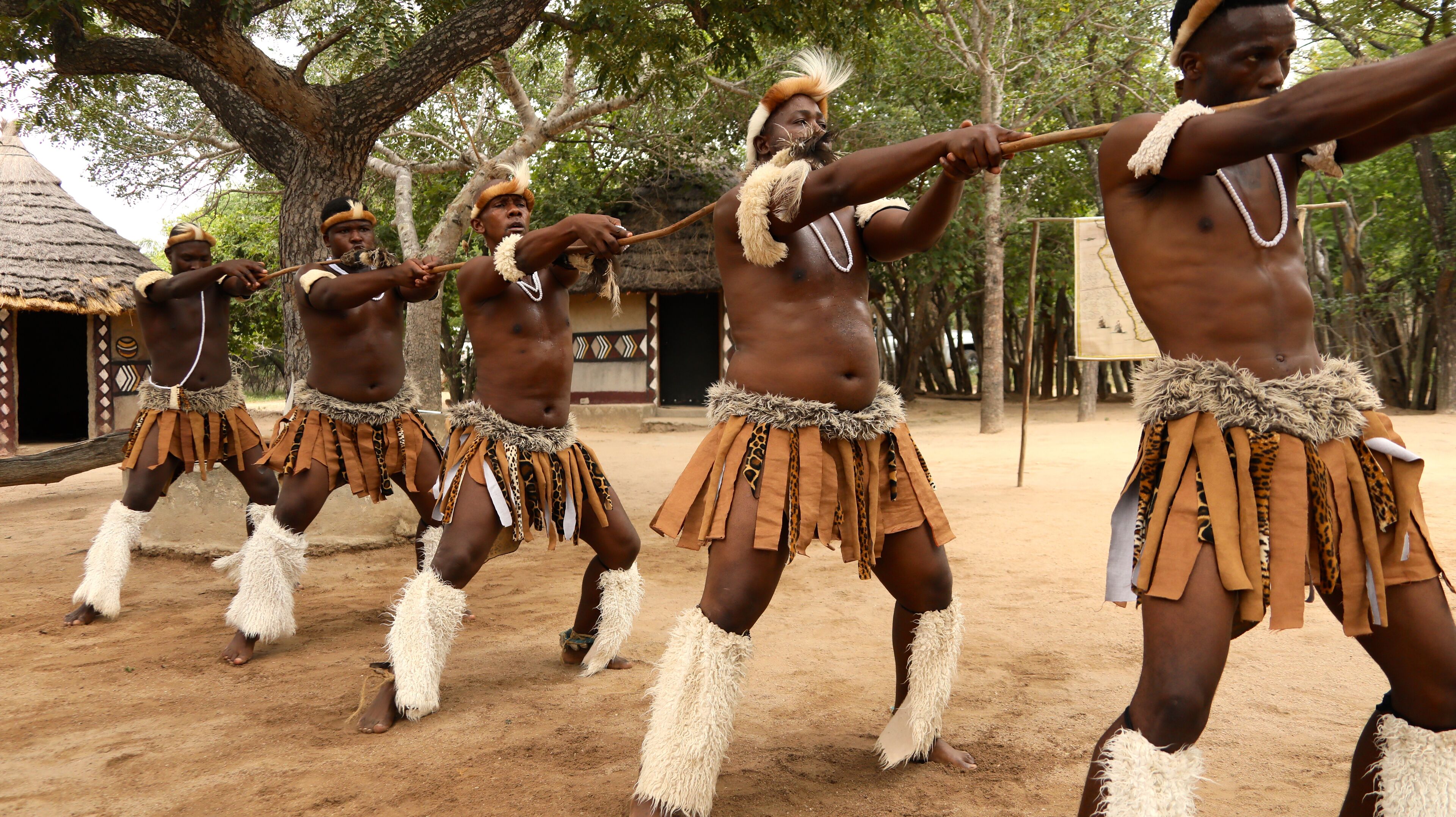 A group of individuals in traditional attire performing a dance.