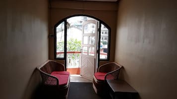 Basic Room, 2 Single Beds | Living area | Flat-screen TV