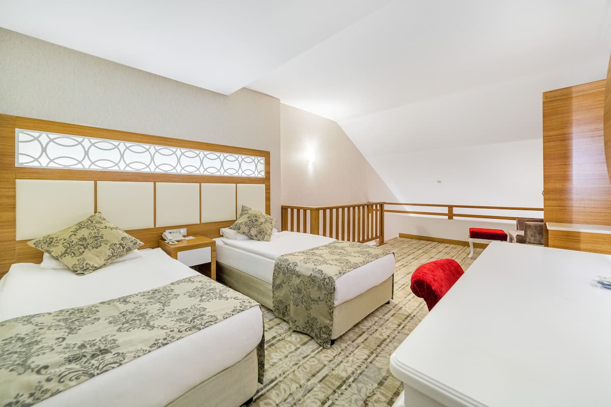 Familiekamer | 2 slaapkamers, een gratis minibar, een kluis op de kamer