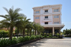 A multi-story hotel with a symmetrical facade, large windows, and a central entrance. - Star Palace Hotel (Rameshwaram)