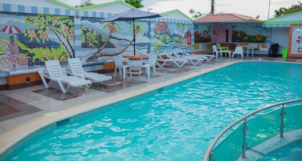 Outdoor pool, open 10 AM to 10 PM, pool loungers