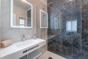 Bathtub, hair dryer, towels, soap