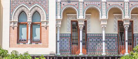 A building with ornate arches and detailed tile work.