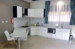 Junior Suite, Non Smoking | Private kitchen | Fridge - Pavillion Hotel (Entebbe)