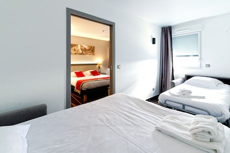 Premium bedding, desk, laptop workspace, soundproofing